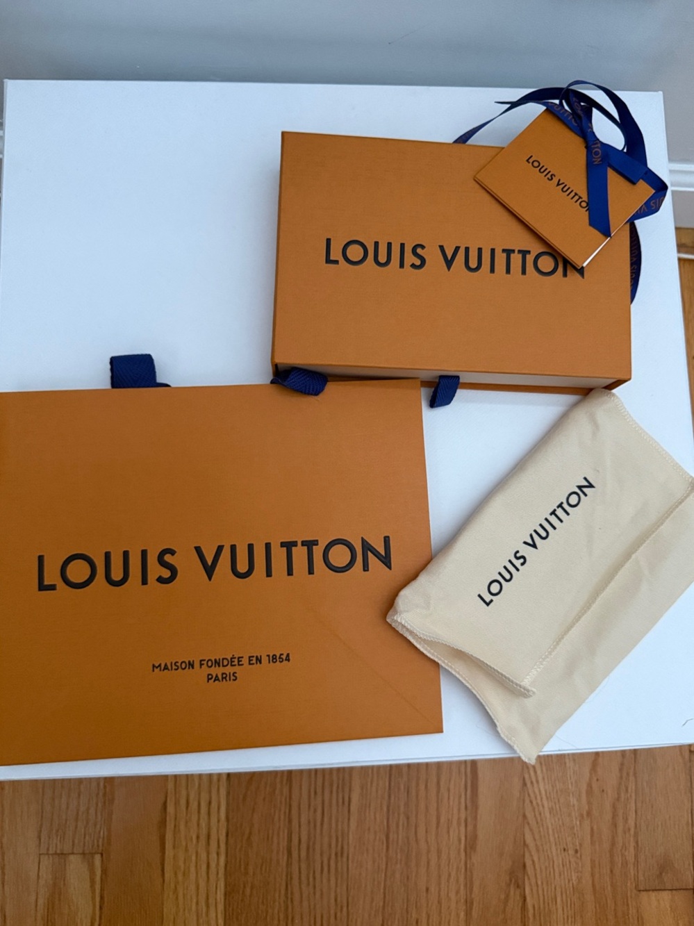 Louis Vuitton Orange Boxes with Navy Ribbon and Beige Dust Bag